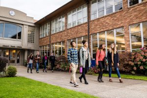 Students walking out of campus building