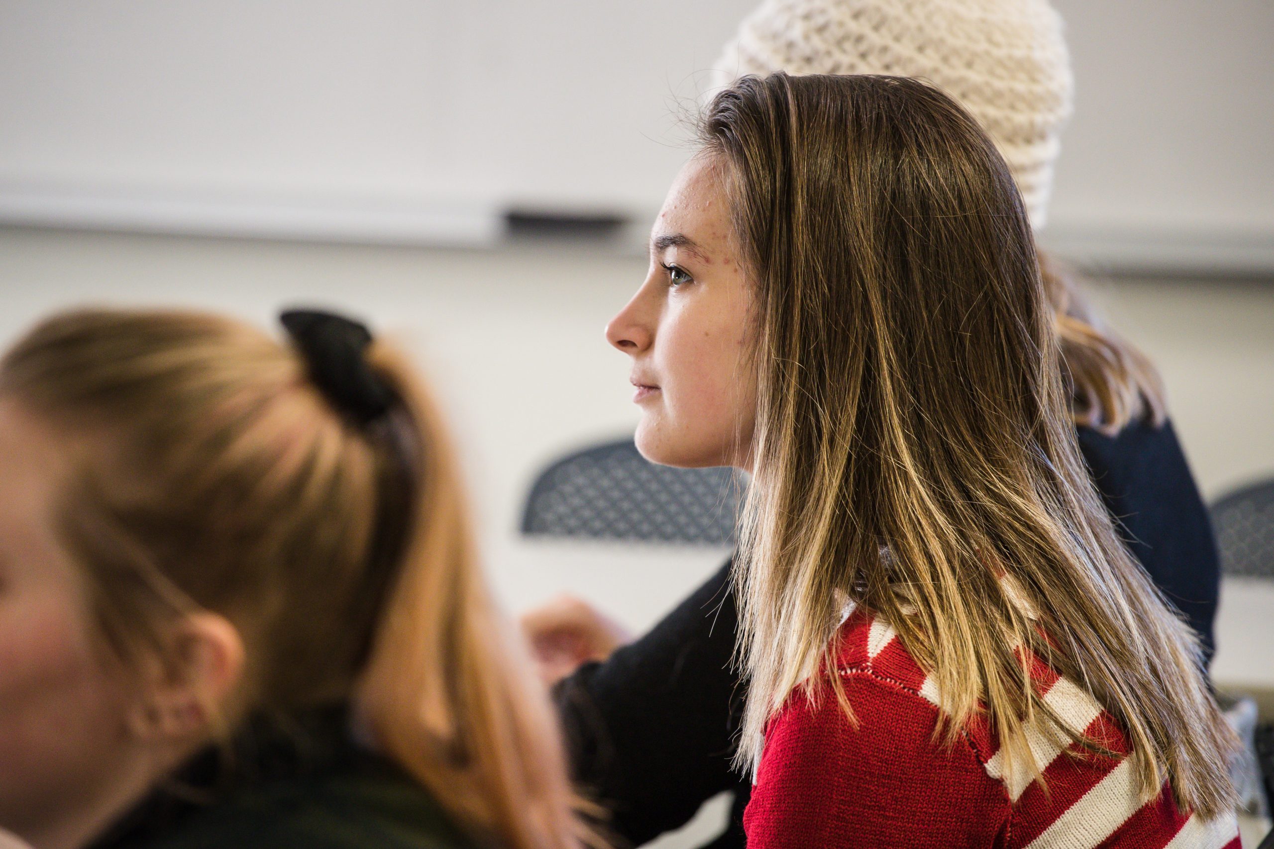 female student looking ahead in classroom