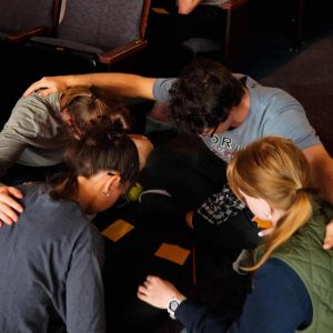 Students participating in a prayer group during a spiritual life gathering at Bushnell University.